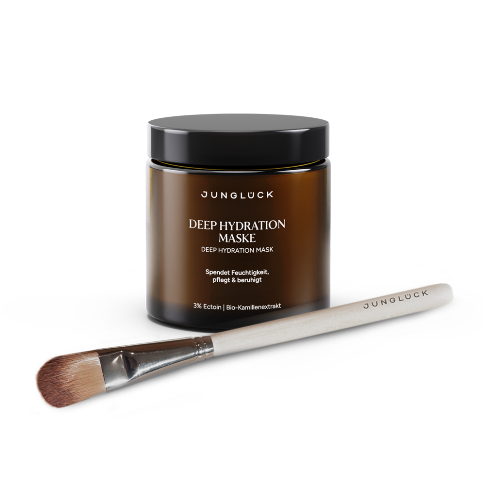 Braunglasdose mit der Deep Hydration Maske von JUNGLÜCK und Pinsel. Die Maske spendet Feuchtigkeit und pflegt.